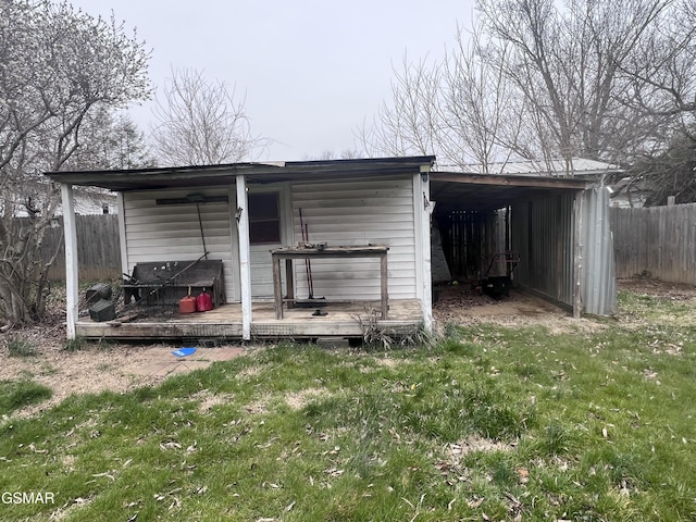 view of outdoor structure with fence