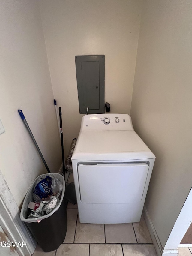 washroom featuring electric panel, washer / clothes dryer, and laundry area