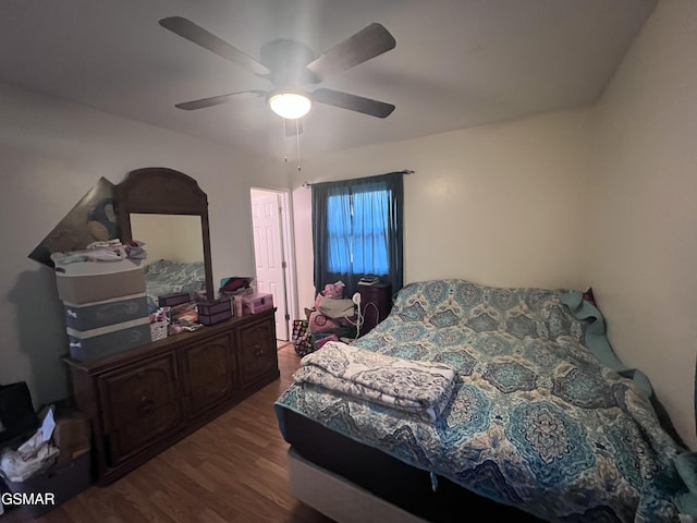 bedroom with wood finished floors and a ceiling fan