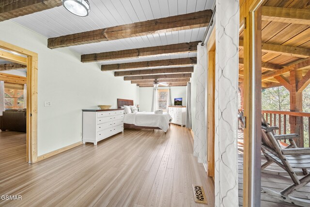 unfurnished bedroom with beamed ceiling, light wood-type flooring, and wooden ceiling