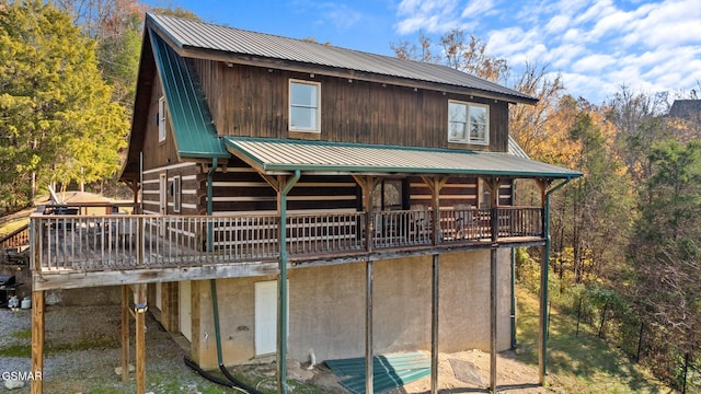 rear view of property with a deck