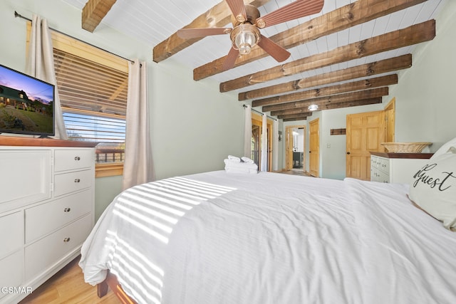 bedroom with beam ceiling, light wood-type flooring, ceiling fan, and wood ceiling