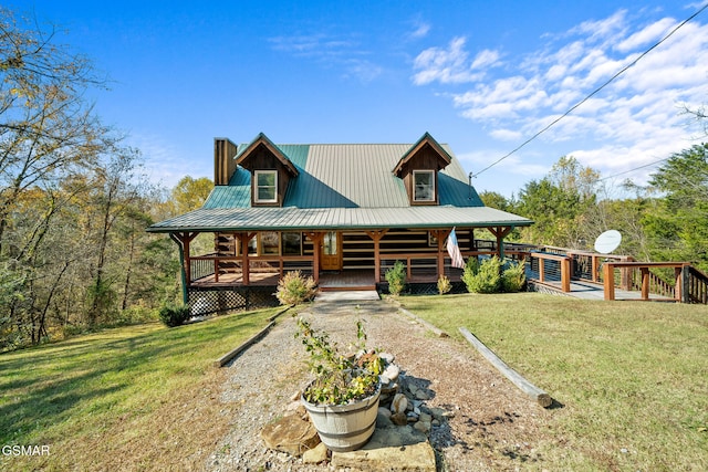 cabin with a front yard