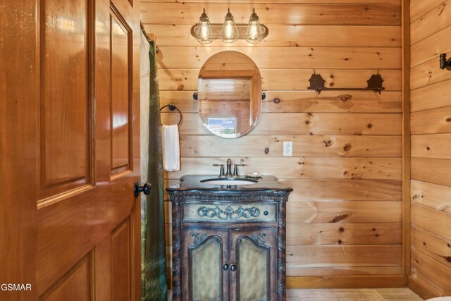 2083 Kerr Rd, Sevierville, TN 37876 - bathroom featuring wood walls and vanity