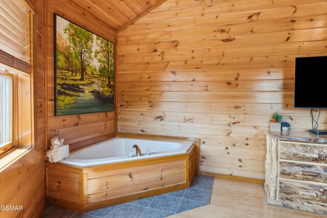 2083 Kerr Rd, Sevierville, TN 37876 - bathroom featuring vaulted ceiling, a garden tub, wooden walls, and wood ceiling