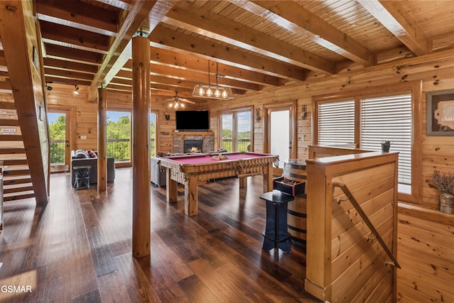 2083 Kerr Rd, Sevierville, TN 37876 - recreation room featuring beam ceiling, a stone fireplace, wood walls, dark wood-style flooring, and billiards