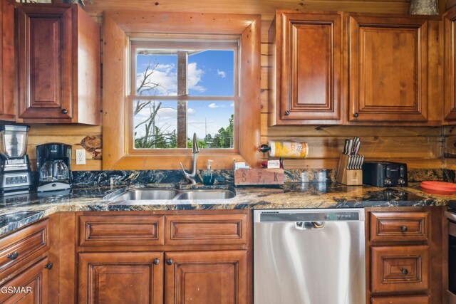 2083 Kerr Rd, Sevierville, TN 37876 - kitchen with stainless steel dishwasher, a sink, brown cabinetry, and dark stone countertops