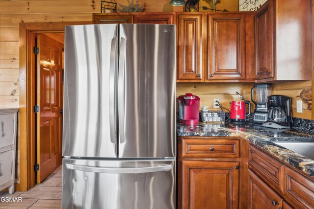 2083 Kerr Rd, Sevierville, TN 37876 - kitchen with freestanding refrigerator and brown cabinetry