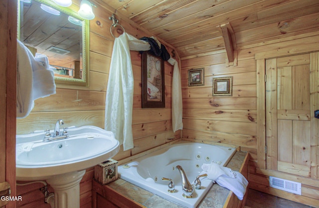 3529 Peggy Ln, Pigeon Forge, TN 37863 - bathroom featuring a tub with jets, wooden walls, and wooden ceiling
