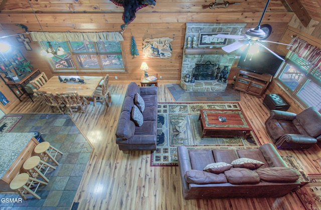 3529 Peggy Ln, Pigeon Forge, TN 37863 - living area with wood finished floors, a ceiling fan, and wood walls