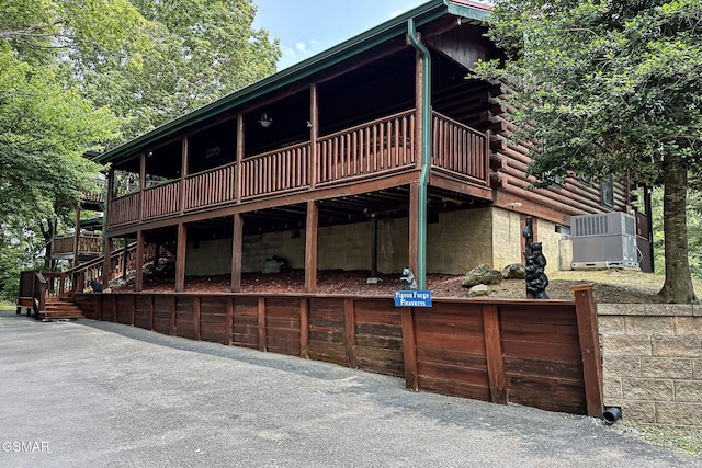 3529 Peggy Ln, Pigeon Forge, TN 37863 - rear view of property with log siding, a deck, and stairway