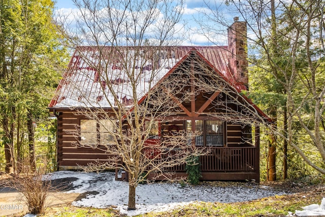 view of front of property featuring a chimney