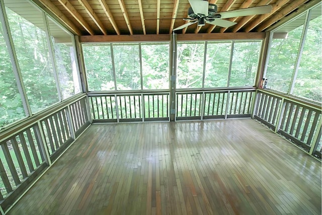 unfurnished sunroom featuring ceiling fan