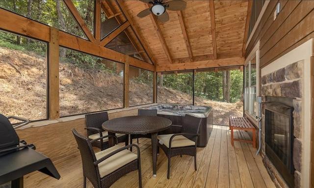 1106 Anastasia Way, Gatlinburg, TN 37738 - sunroom with ceiling fan, outdoor dining area, and an outdoor stone fireplace