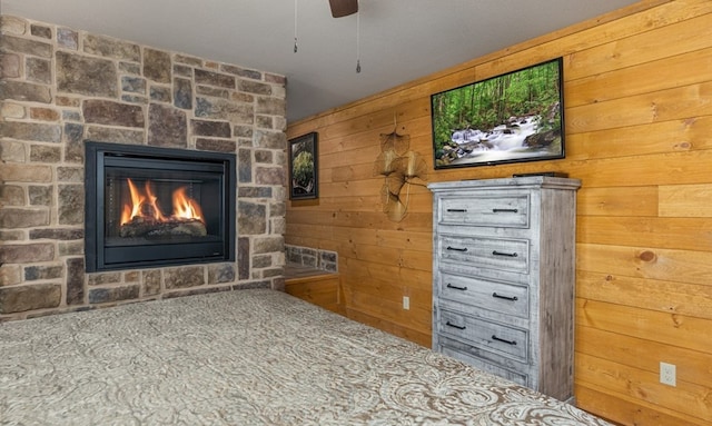 1106 Anastasia Way, Gatlinburg, TN 37738 - detailed view of wood walls, a stone fireplace, and a ceiling fan
