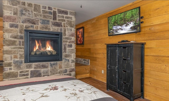 1106 Anastasia Way, Gatlinburg, TN 37738 - bedroom with wood finished floors, a fireplace, wood walls, and a closet