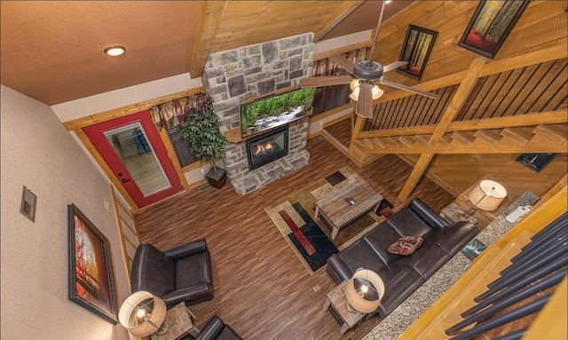 1106 Anastasia Way, Gatlinburg, TN 37738 - living room with a fireplace, beamed ceiling, a textured wall, wood finished floors, and ceiling fan