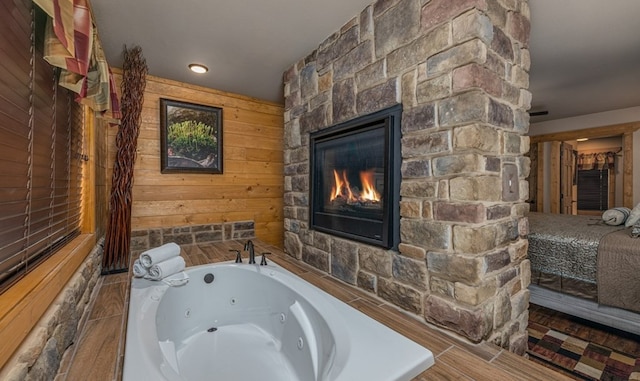1106 Anastasia Way, Gatlinburg, TN 37738 - full bath with a whirlpool tub, a stone fireplace, and wood walls