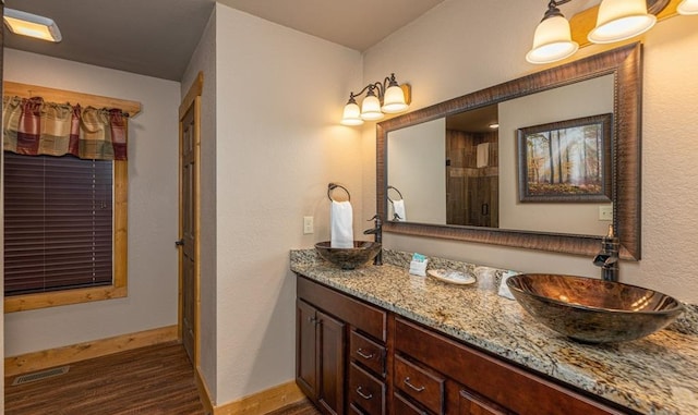 1106 Anastasia Way, Gatlinburg, TN 37738 - full bathroom featuring double vanity, wood finished floors, and a shower