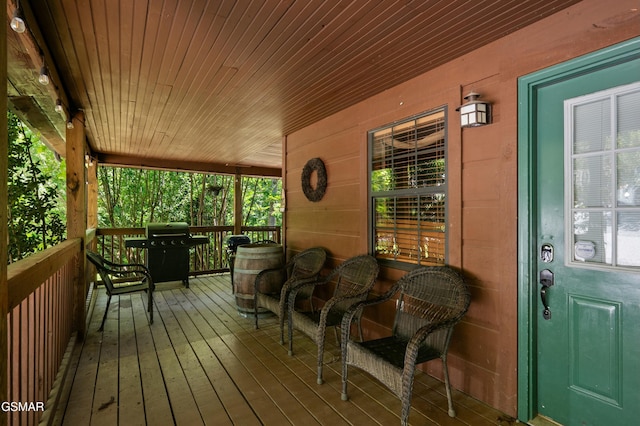 deck featuring area for grilling and covered porch