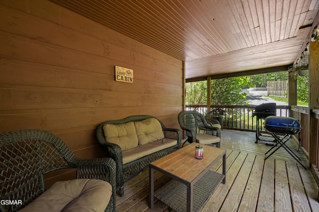 wooden terrace featuring outdoor lounge area