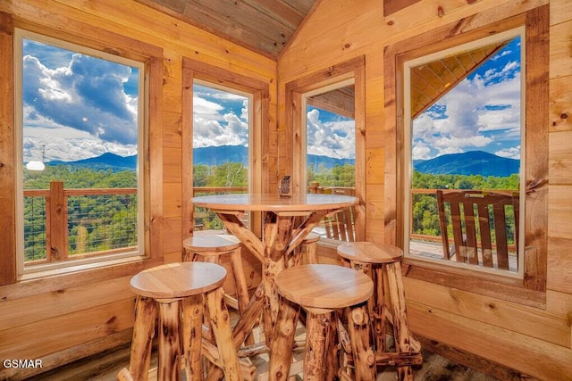 sunroom / solarium featuring a mountain view