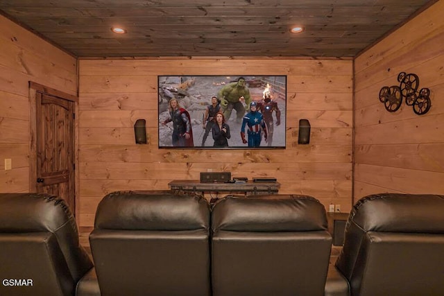 cinema room with wood ceiling, wood walls, and recessed lighting