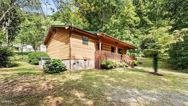 1204 Piney Mountain Rd, Newport, TN 37821 - view of property exterior with covered porch, crawl space, a yard, and a view of trees