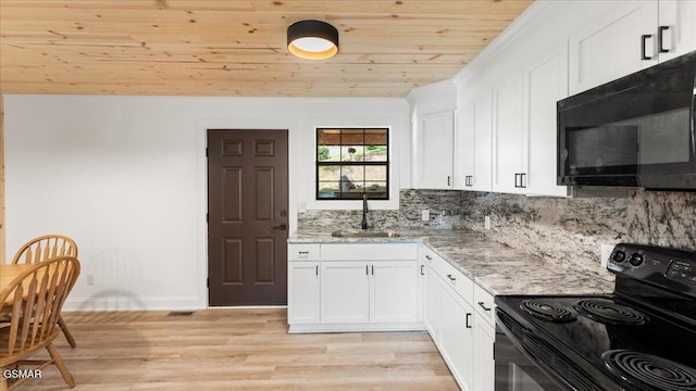 1204 Piney Mountain Rd, Newport, TN 37821 - kitchen with black appliances, wooden ceiling, white cabinets, light wood finished floors, and light stone countertops