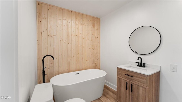 1204 Piney Mountain Rd, Newport, TN 37821 - bathroom featuring a freestanding bath, vanity, and wood finished floors