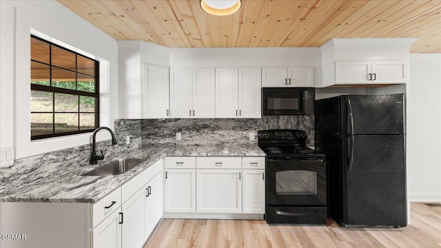 1204 Piney Mountain Rd, Newport, TN 37821 - kitchen featuring black appliances, wooden ceiling, light wood finished floors, light stone countertops, and white cabinetry