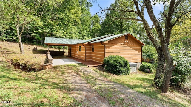 1204 Piney Mountain Rd, Newport, TN 37821 - view of side of home with an attached carport and a metal roof