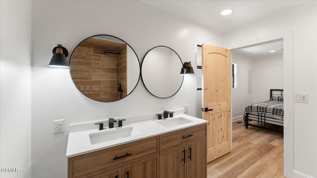 1204 Piney Mountain Rd, Newport, TN 37821 - bathroom with double vanity, wood finished floors, ensuite bath, and recessed lighting