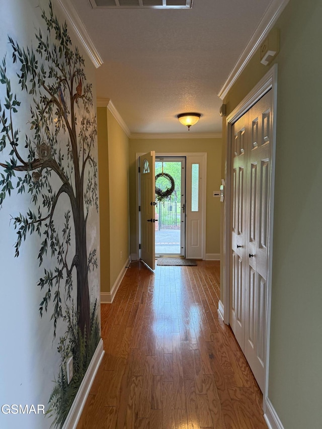 915 Fine Glen Dr, Sevierville, TN 37862 - doorway to outside featuring crown molding, wood finished floors, and baseboards