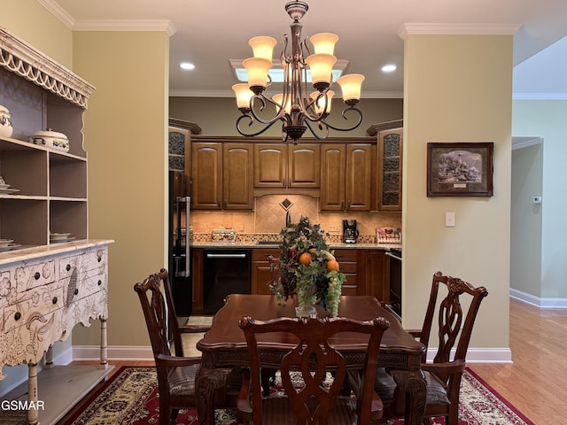 915 Fine Glen Dr, Sevierville, TN 37862 - dining space with a chandelier, baseboards, light wood-type flooring, crown molding, and recessed lighting