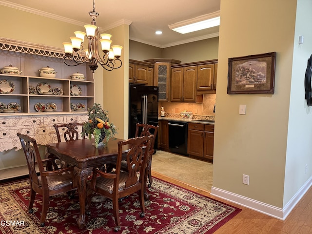 915 Fine Glen Dr, Sevierville, TN 37862 - dining space with a chandelier, crown molding, light wood finished floors, baseboards, and recessed lighting