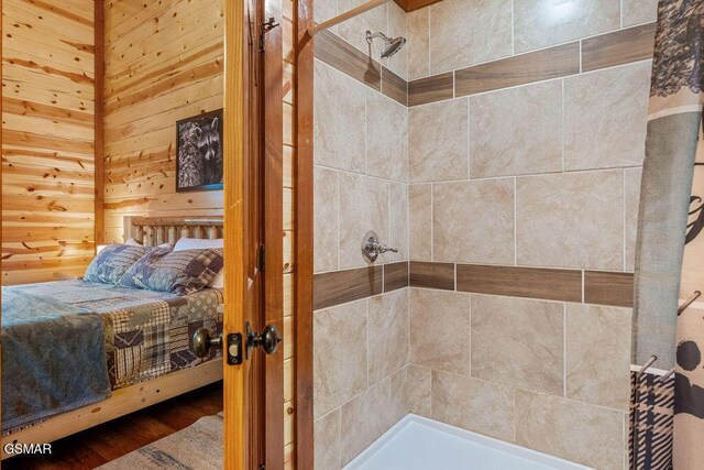 2864 Owens Ridge Way, Sevierville, TN 37876 - full bathroom featuring a tile shower and wood finished floors