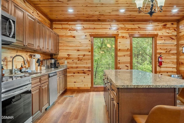 2864 Owens Ridge Way, Sevierville, TN 37876 - kitchen with appliances with stainless steel finishes, a sink, wooden ceiling, light wood-type flooring, and a chandelier