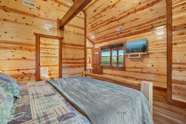 2864 Owens Ridge Way, Sevierville, TN 37876 - bedroom with wood finished floors, wooden walls, and access to exterior