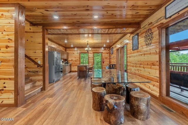 2864 Owens Ridge Way, Sevierville, TN 37876 - dining area with wood ceiling, wooden walls, light wood-style flooring, and recessed lighting