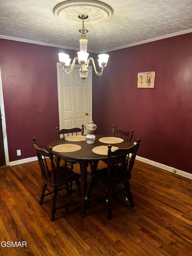 206 Bunker Ln, Oak Ridge, TN 37830 - dining room featuring wood-type flooring, a textured ceiling, a chandelier, and crown molding