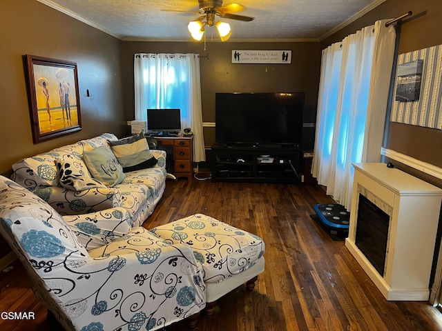 206 Bunker Ln, Oak Ridge, TN 37830 - living room with ornamental molding, dark wood finished floors, a ceiling fan, a textured ceiling, and a fireplace