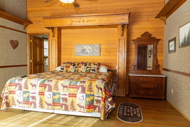 bedroom with hardwood / wood-style floors and ceiling fan