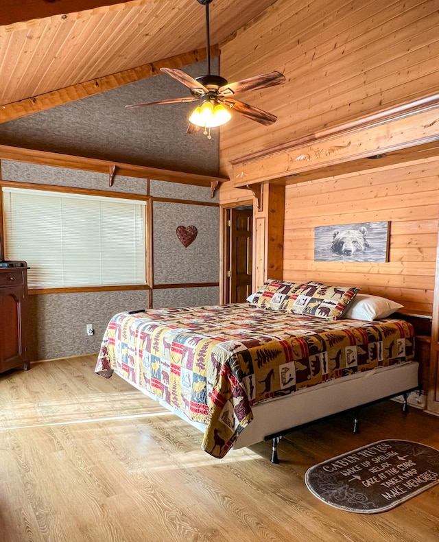 bedroom featuring ceiling fan, light hardwood / wood-style flooring, and wooden ceiling