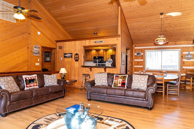 living room featuring high vaulted ceiling, light hardwood / wood-style flooring, ceiling fan, and wood ceiling