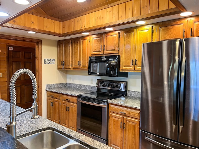 kitchen with sink, wooden ceiling, stainless steel appliances, and vaulted ceiling