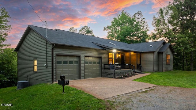 4822 White Pine Way, Sevierville, TN 37876 - view of front of home featuring driveway, covered porch, an attached garage, and a front lawn