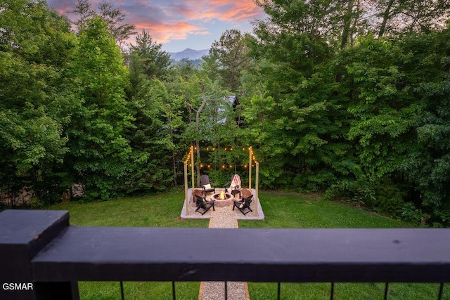 4822 White Pine Way, Sevierville, TN 37876 - view of jungle gym with a fire pit, a lawn, a mountain view, and a wooded view