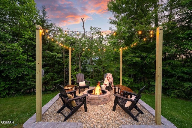 4822 White Pine Way, Sevierville, TN 37876 - patio terrace at dusk with a fire pit and a yard
