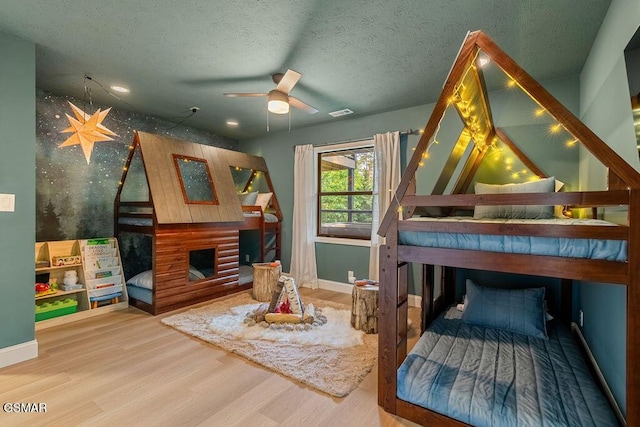 4822 White Pine Way, Sevierville, TN 37876 - bedroom featuring wood finished floors, wallpapered walls, and a brick fireplace